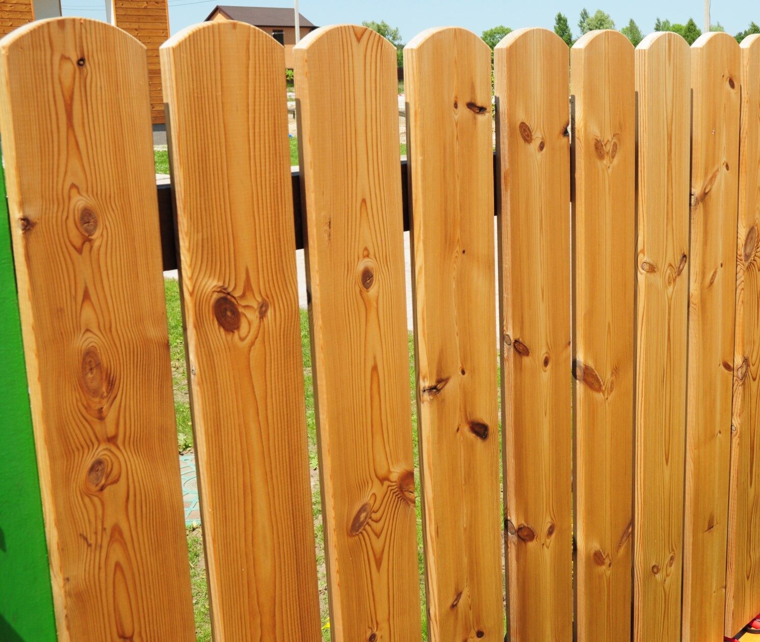 Residential landscaping project with greenery and outdoor detail work.